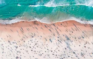 Aerial overlooking beachgoers on Bondi Beach, Sydney.