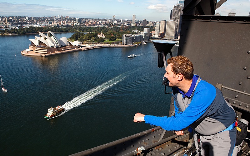 Adult stopping to admire Sydney Harbour while doing Bridge Climb