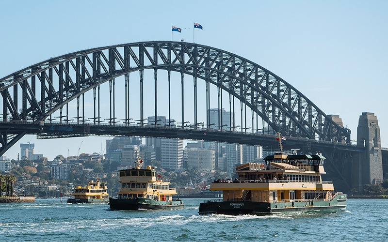 3 ferries on Sydney Harbour with the Harbour Bridge in background