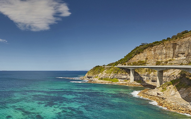 A photograph of the Sea Cliff Bridge on a sunny day