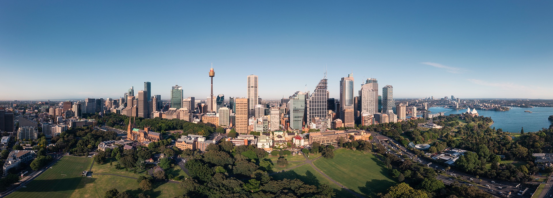 An ultrawide aerial photo of Sydney from the Domain facing the CBD